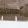 Žlutice - Marklův kříž | Marklův kříž pod náspem silnice u železničního nádraží ve Žluticích na historické fotografii z počátku 20. století