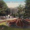 Karlovy Vary - Poštovní dvůr | zahradní restaurace na kolorované pohlednici z roku 1911