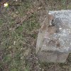 Skoky - Lienerthův kříž | zdevastovaná hlavice rozlomeného podstavce Lienerthova kříže v zaniklé vsi Skoky - březen 2016