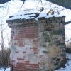 Valeč - Hoppova kaple | západní stěna kaple s vydětelným tělesem původní kamenné kapličky - únor 2011