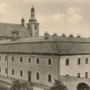 Ostrov - piaristický klášter | areál piaristického kláštera na pohlednici z roku 1930